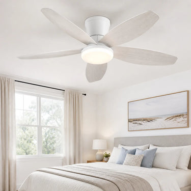 Serene low profile ceiling fan with light installed in a calm modern bedroom