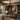Farmhouse style ceiling fan light in a rustic home office with wood desk and built in shelves