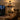 Kviflon 6038 rustic wooden caged ceiling fan installed in a cozy farmhouse style dinning room, creating a warm ambient statement.
