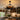 Kviflon 6038 rustic wooden caged ceiling fan installed in a cozy farmhouse style dinning room, creating a warm ambient statement.