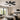 Black 42 inch flush mount ceiling fan with light installed in a modern bedroom