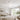 white flush mount ceiling fan with LED light installed in modern bedroom clean interior design