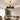 Ribbon Crystal black and gold retractable blade crystal fandelier in a modern living room