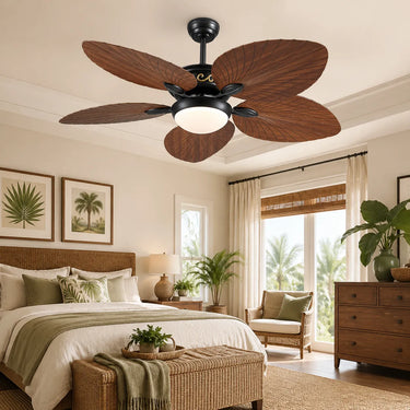 Bright and airy sunroom patio featuring the 8230 tropical palm leaf ceiling fan above comfortable wicker furniture.