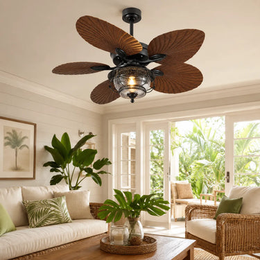 Cozy rustic style living room decor with a 52 inch palm leaf ceiling fan light installed near large glass doors.