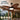 8919 IP44 wet rated outdoor ceiling fan with tropical palm leaf blades for covered patios and porches.