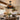 Farmhouse style ceiling fan light above a rustic dining table in a cozy dining room