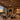 Kviflon 9001 giant 100 inch industrial ceiling fan running in a spacious high-ceiling family patio