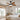 Rattan blade ceiling fan with light installed in a bright boho style American bedroom